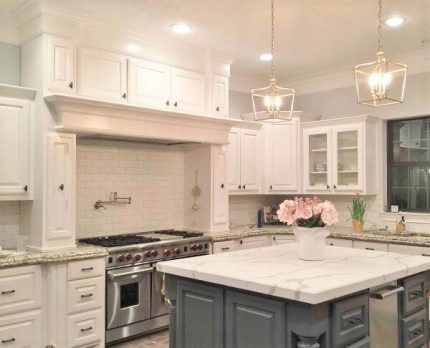 Modern kitchen remodeling with island and stainless steel appliances in Long Island, NY.