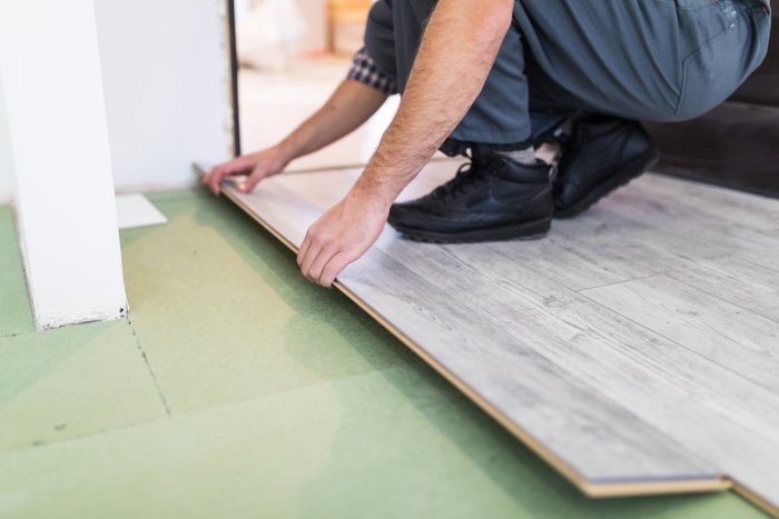 Professional flooring installation in progress in a Long Island home
